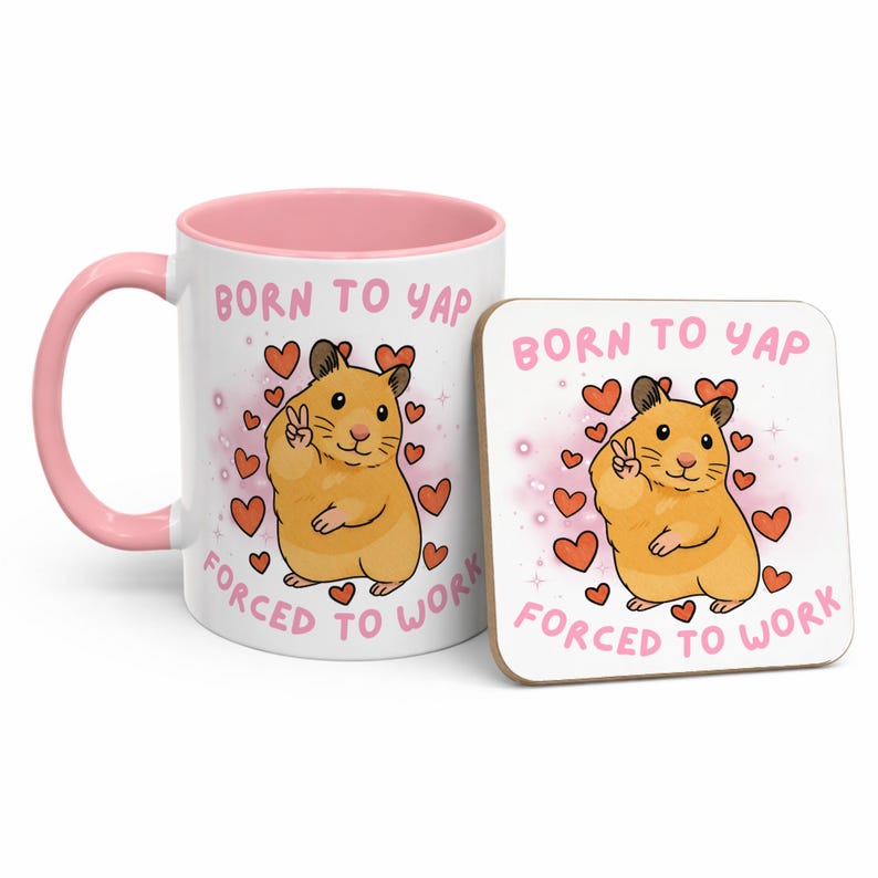 May include: A white ceramic mug with a pink interior and handle, and a matching square coaster. Both feature a cartoon hamster with a peace sign, surrounded by hearts, and the text "BORN TO YAP FORCED TO WORK."