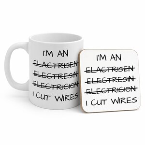 May include: A white ceramic mug and a square coaster featuring the black printed text: I'M AN ELACTRISEN, ELECTRESIN, ELECTRICION, I CUT WIRES. The words ELACTRISEN, ELECTRESIN, and ELECTRICION are crossed out with a horizontal black line.