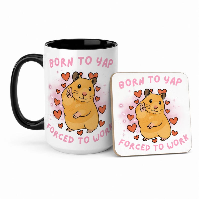 May include: A white ceramic mug with a black handle and interior, and a matching coaster. Both feature a cartoon hamster with a peace sign, surrounded by hearts, and the text "BORN TO YAP FORCED TO WORK."
