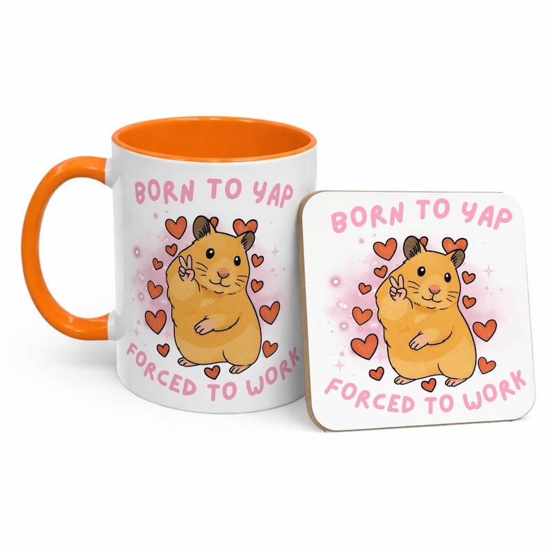May include: A white ceramic mug with an orange interior and handle, and a matching square coaster. Both feature a cartoon hamster with a peace sign, surrounded by hearts, and the text "BORN TO YAP FORCED TO WORK."