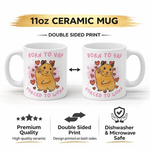 May include: White ceramic mug with a double-sided print. The mug features a cartoon hamster with a peace sign, surrounded by hearts, and the text "BORN TO YAP, FORCED TO WORK". The mug holds 11oz.