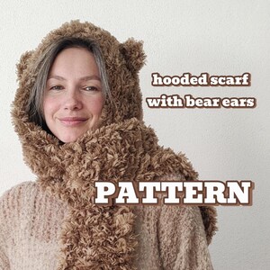 May include: A brown hooded scarf with bear ears. The scarf is made of a fluffy, fuzzy material. The text "hooded scarf with bear ears" and "PATTERN" is visible in the image.