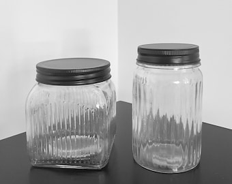 Set of 2 pretty grooved glass storage jars & black metal lid