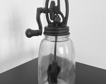 Small vintage butter churn in glass, cast iron and black wood