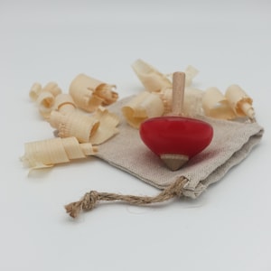 Handgedrehter Kreisel aus Holz und Epoxidharz: traditionelles und elegantes Spielzeug