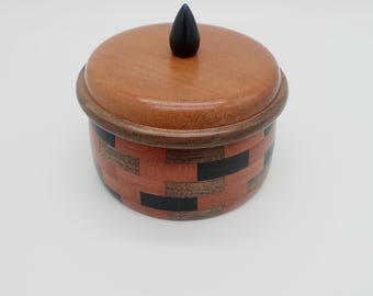 Segmented turned wooden box with lid and knob