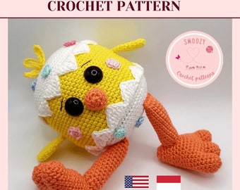 May include: Crochet pattern for a yellow chick with white and pink accents, wearing an egg shell. The chick has large black eyes and orange legs. The pattern is available in English and Hungarian. "Download pdf-pattern" is written below the image.