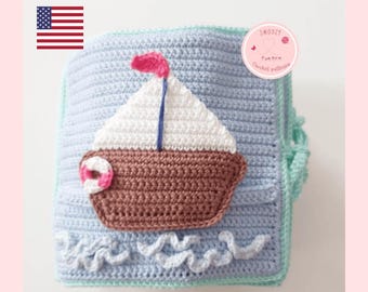 May include: A crochet baby book with a blue and green cover. The book features a brown sailboat with a white sail and a pink flag. The text "download pdf-pattern" is at the bottom of the image.