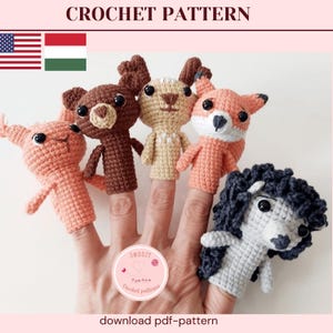 May include: Crochet pattern featuring five handmade finger puppets: a pink pig, a brown bear, a tan deer, an orange fox, and a gray poodle. The puppets are displayed on fingers. The text "CROCHET PATTERN" is at the top.