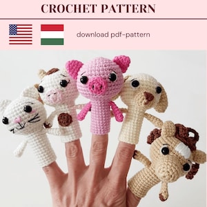May include: Five finger puppets made of crocheted yarn. The puppets are a cat, a cow, a pig, a dog, and a horse. The puppets are all wearing different colors of yarn. The puppets are all on a hand.
