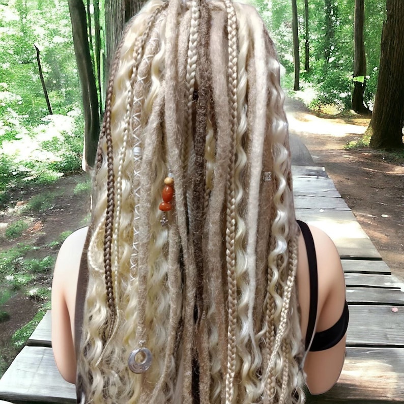 May include: A set of long, blonde and brown synthetic dreadlocks with beads and charms. The dreadlocks are styled in a variety of textures, including straight, wavy, and curly.