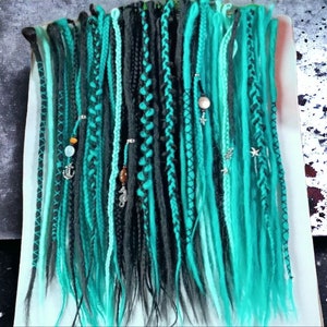 Statement-Making Teal and Black Dreadlocks: Trendy Hairpiece for a Bold Hairstyle