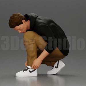 Scale Figure 1/35 1/43 1/64 Man in hoodie crouching down tying shoelaces focused in casual outfit - Ideal for Dioramas - Hand Painted