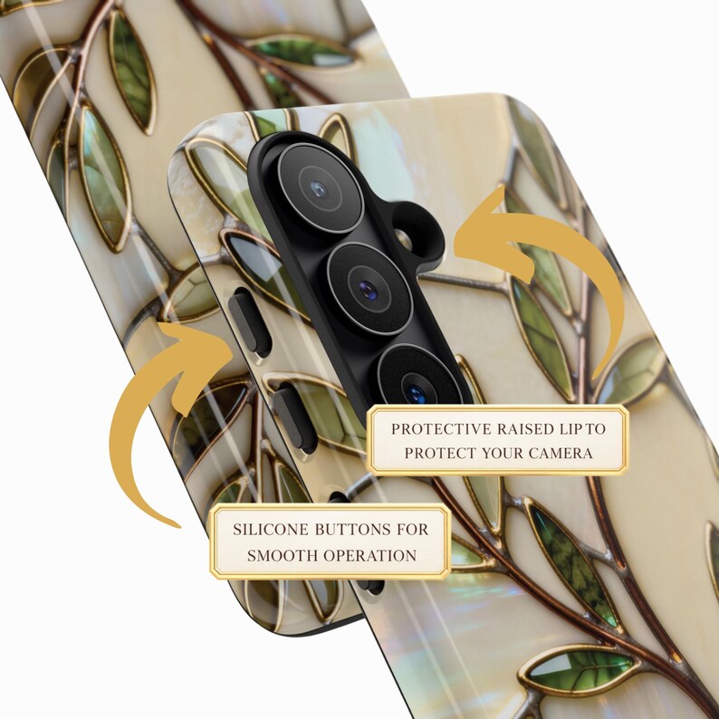 May include: A phone case featuring a cream-colored background with a pattern of brown branches and green leaves. The case includes a black camera housing with a protective raised lip and silicone buttons. Text labels read: PROTECTIVE RAISED LIP TO PROTECT YOUR CAMERA and SILICONE BUTTONS FOR SMOOTH OPERATION.