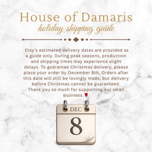 May include: A white marble-textured graphic featuring the text House of Damaris holiday shipping guide, followed by a paragraph about delivery dates and a calendar icon displaying the date DEC 8 with a small red rose emoji at the end.