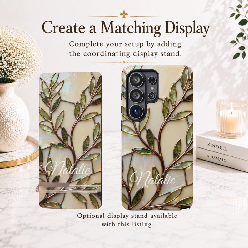 May include: A smartphone case featuring a stained glass-inspired design with green leaves, brown branches, and an iridescent cream background. The name Natalie is printed in white script. Text on the image reads Create a Matching Display.