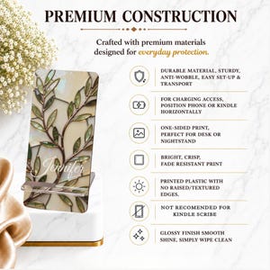 May include: A rectangular phone and tablet stand featuring a stained glass-style leaf pattern in shades of green and cream with the name Jennifer printed in white script. The stand includes text detailing product features and construction.