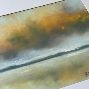 May include: A pastel painting of a seascape with a golden yellow sky and a blue-grey ocean. The painting has a soft, dreamy feel.