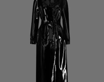 May include: A long black trench coat with a shiny, wet look. The coat has a belt and a double-breasted closure.