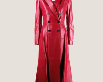 May include: A long red leather coat with a double-breasted closure and a flared skirt.