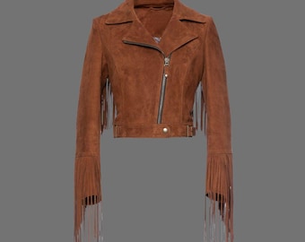 May include: A brown suede jacket with fringe detailing on the sleeves and hem. The jacket has a zipper closure and a belt at the waist.