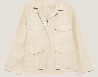 May include: A cream-coloured leather jacket with a zip fastening and multiple pockets.