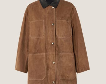 May include: A brown suede jacket with a black leather collar. The jacket has four front pockets and is buttoned up the front with silver buttons. The jacket is a medium length and has long sleeves.