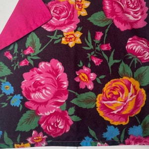 May include: A dark brown fabric square with a pink floral pattern. The fabric has a pink backing and measures 37 x 37 cm.