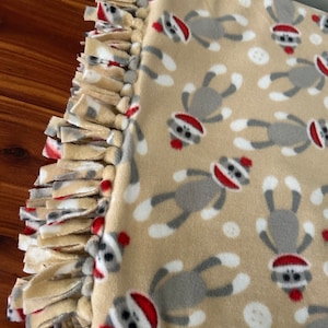 Sock monkey fleece tie blanket