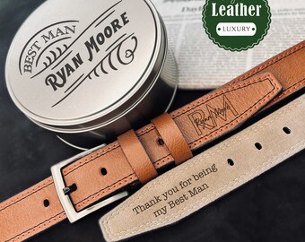 May include: A brown leather belt with a silver buckle and a personalized inscription that reads "Thank you for being my Best Man". The belt is packaged in a silver tin with the inscription "Best Man Ryan Moore".