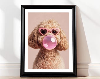 May include: A light brown poodle wearing pink heart-shaped sunglasses and blowing a pink bubble. The dog is looking directly at the camera.
