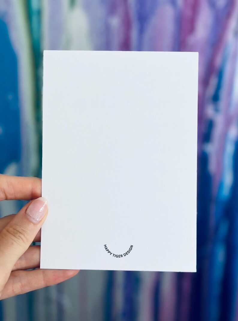 May include: Blank white card with a small, black, circular logo that reads "Happy Tiger Design".