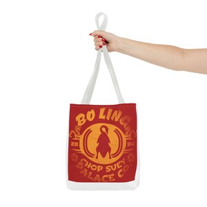 May include: White canvas tote bag with a red fabric panel featuring a vintage-style logo for "Bo Ling Chop Suey Palace Co.". The logo features a stylised bird silhouette and the text "Bo Ling Chop Suey Palace Co."