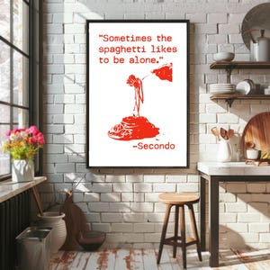 May include: A framed art print with a white background and red graphic of spaghetti. The text reads "Sometimes the spaghetti likes to be alone." and "-Secondo". The print is in a black frame.