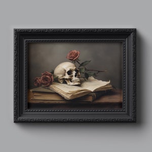May include: A framed painting of a still life featuring a human skull, two red roses, and an open book. The skull is resting on the book, and the roses are placed on the book and behind the skull. The painting is set against a dark background.