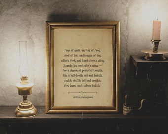 May include: A framed print with a gold-colored frame displays a vintage-style poem by William Shakespeare. A brass oil lamp and a candle holder with a lit candle sit on a dark wooden shelf, creating a warm, antique aesthetic.
