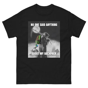 May include: Black t-shirt featuring a white graphic of the Grim Reaper carrying a green backpack. The text "NO ONE SAID ANYTHING ABOUT MY BACKPACK" is printed on the shirt.
