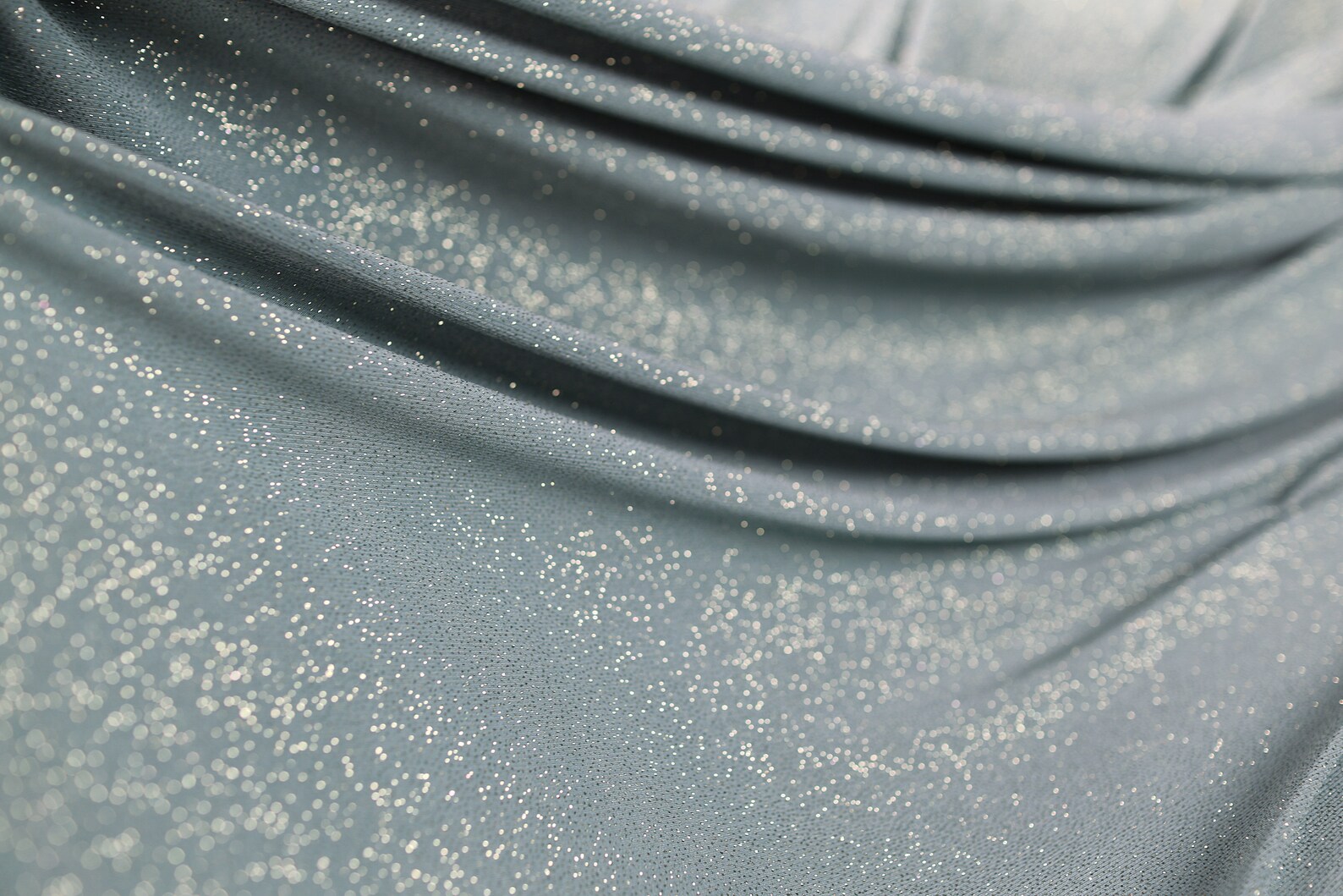Sage Green 2 Way Stretch Glimmer Knit Fabric. Metallic Glitter Spandex