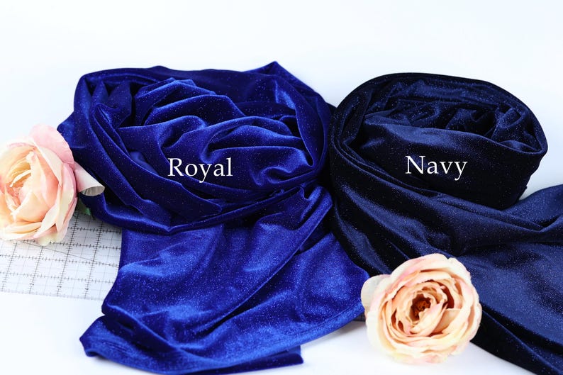 two fabric swatches, one royal blue and one navy blue, with a pink rose on the left side.