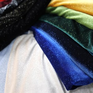 a pile of different colored cloths sitting on top of each other