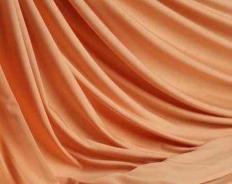 Peach Venezia Knit Fabric: 4-Way Stretch Matte Jersey for Dresses