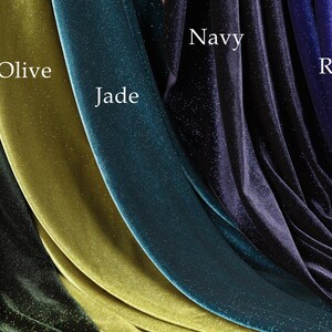 a collection of velvet fabric swatches in various colors, including olive, jade, hunter green, navy, and royal.