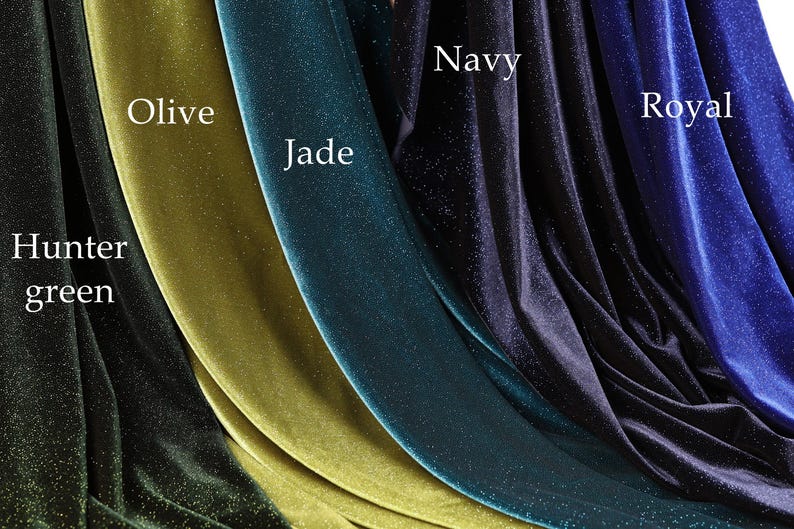 a collection of velvet fabric swatches in various colors, including olive, jade, hunter green, navy, and royal.