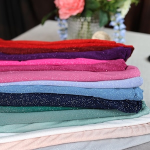 a stack of cloths sitting on top of a table