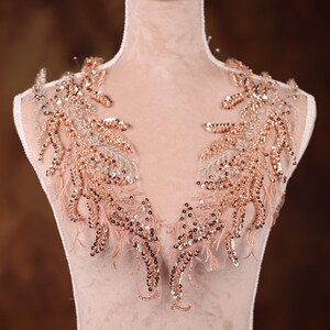 May include: Rose gold beaded lace applique with a delicate floral design. This embellishment is perfect for adding a touch of elegance to wedding dresses, bridal gowns, or other special occasion garments.