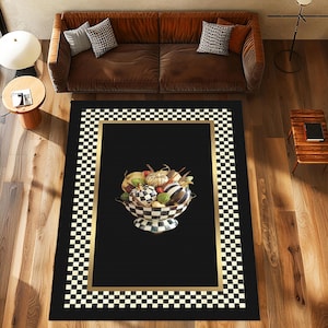 May include: Black and white checkered rug with a gold border and a black center featuring a bowl of colorful gourds and fruit.