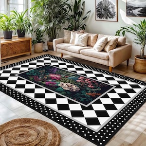 May include: A large area rug with a black and white checkered pattern and a floral center design. The rug has a black border with white polka dots. The floral design features pink and white flowers.