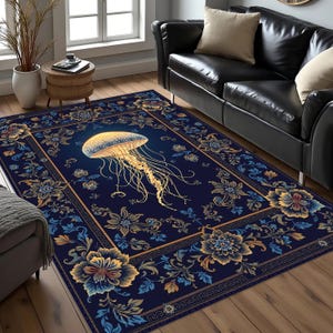 May include: A rectangular area rug featuring a deep navy blue background with a central golden jellyfish illustration. The rug is decorated with a symmetrical border of intricate floral patterns in shades of gold, blue, and cream.