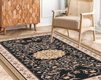 May include: A rectangular area rug featuring a black central field with a large beige and tan floral medallion, surrounded by intricate scrolling vine patterns and a wide beige border with repeating floral motifs in black and tan tones.