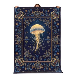 May include: A rectangular throw blanket featuring a central glowing jellyfish with long, trailing tentacles against a deep navy blue background. The border displays an intricate floral pattern in shades of gold, light blue, and dark blue.